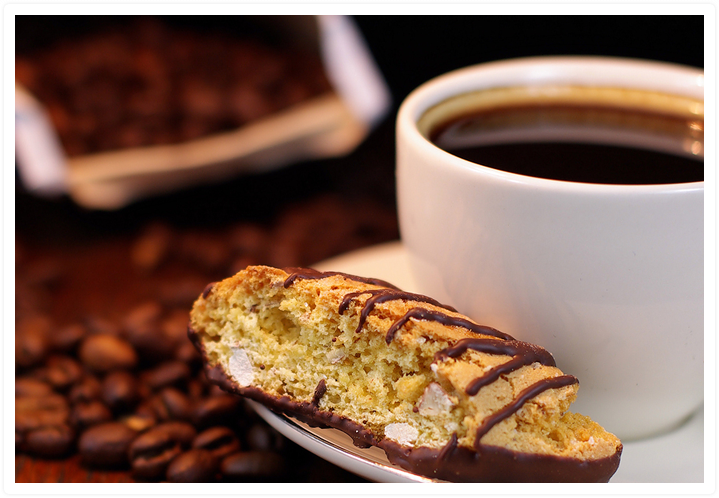 Cup of Kona Coffee with biscotti